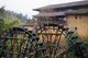 China: Waterwheels serving the Hakka earth houses near Hukeng, Yongding County, Fujian Province
